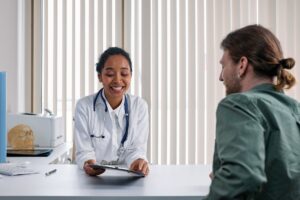 Healthcare administrative professionals working with digital systems in a modern hospital setting